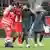 Lena Oberdorf is helped off the pitch