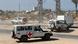 Transporte de los cuerpos de prisioneros palestinos en un vehículo de la Cruz Roja. Transporte de los cuerpos de prisioneros palestinos en un vehículo de la Cruz Roja.