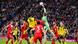 Bayern Munich and Borussia Dortmund players compete for a high ball, which is punched by Manuel Neuer Bayern Munich and Borussia Dortmund players compete for a high ball, which is punched by Manuel Neuer