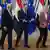 From left, European Council President Antonio Costa, Egypt's President Abdel Fattah El-Sisi and European Commission President Ursula von der Leyen arrive for an EU-Egypt Summit, walking in front of EU and Egyptian flags. They are smiling and laughing.