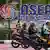 Motorists stop at a traffic light next to the logo of the Association of Southeast Asian Nations (ASEAN) 