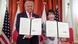 US President Donald Trump (left) stands beside Japanese Prime Minister Sanae Takaichi (right), both show off signed documents to the camera US President Donald Trump (left) stands beside Japanese Prime Minister Sanae Takaichi (right), both show off signed documents to the camera