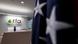 An American flag is seen in the foreground of the empty reception desk at Radio Free Asia in Washington, DC An American flag is seen in the foreground of the empty reception desk at Radio Free Asia in Washington, DC