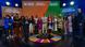 Group photo of the UN SDG Award finalists and judges on a stage Group photo of the UN SDG Award finalists and judges on a stage