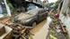A car covered in muddy residue, trees uprooted all around, Cebu city A car covered in muddy residue, trees uprooted all around, Cebu city