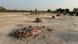 A pile of bricks serves as a grave in a dirt lot in Pakistan A pile of bricks serves as a grave in a dirt lot in Pakistan