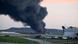 Fire and smoke mark where a UPS cargo plane crashed near Louisville Muhammad Ali International Airport, Kentucky, the United States Fire and smoke mark where a UPS cargo plane crashed near Louisville Muhammad Ali International Airport, Kentucky, the United States
