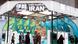 Šareni štand na sajmu s natpisom Iran Šareni štand na sajmu s natpisom Iran