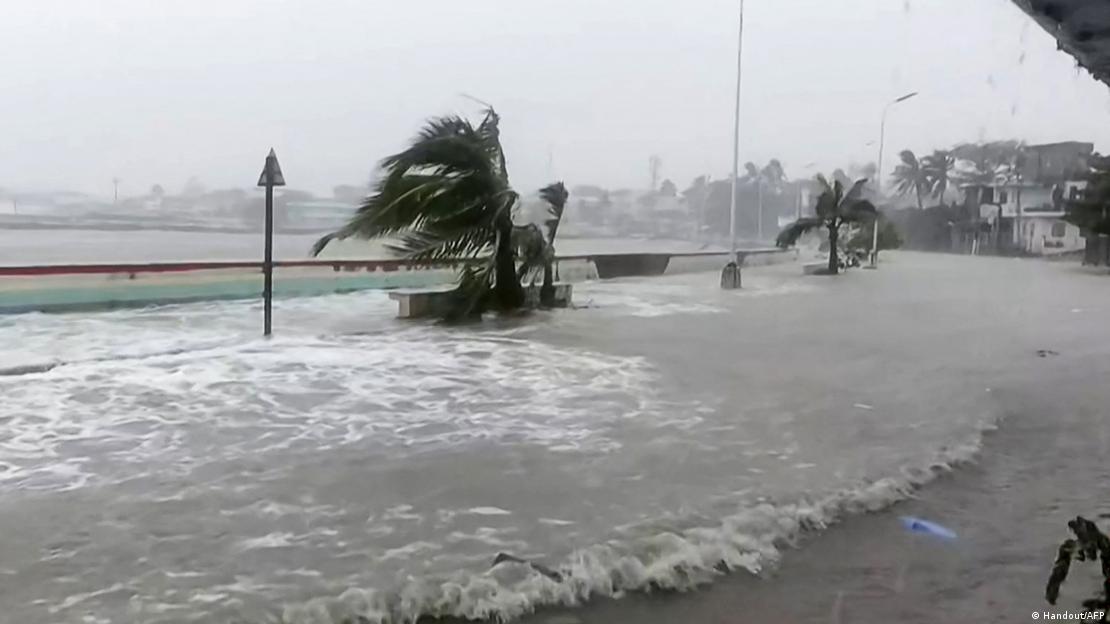 This screen grab made from UGC handout video footage courtesy of Facebook user Edson Casarino taken and released on November 9, 2025 shows storm surges sending waves hurtling over streets of Virac This screen grab made from UGC handout video footage courtesy of Facebook user Edson Casarino taken and released on November 9, 2025 shows storm surges sending waves hurtling over streets of Virac