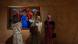 Three women view art at MOWAA Three women view art at MOWAA
