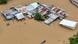 This aerial photo shows a resident paddles his boat in the flood waters past inundated houses in Tuguegarao City, Cagayan province, north of Manila on November 10, 2025, after a river overflowed following heavy rains brought about by Super Typhoon Fung-wong. This aerial photo shows a resident paddles his boat in the flood waters past inundated houses in Tuguegarao City, Cagayan province, north of Manila on November 10, 2025, after a river overflowed following heavy rains brought about by Super Typhoon Fung-wong.