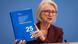 Germany Council of Economic Experts Chair Monika Schnitzer holds up the council's annual report Germany Council of Economic Experts Chair Monika Schnitzer holds up the council's annual report