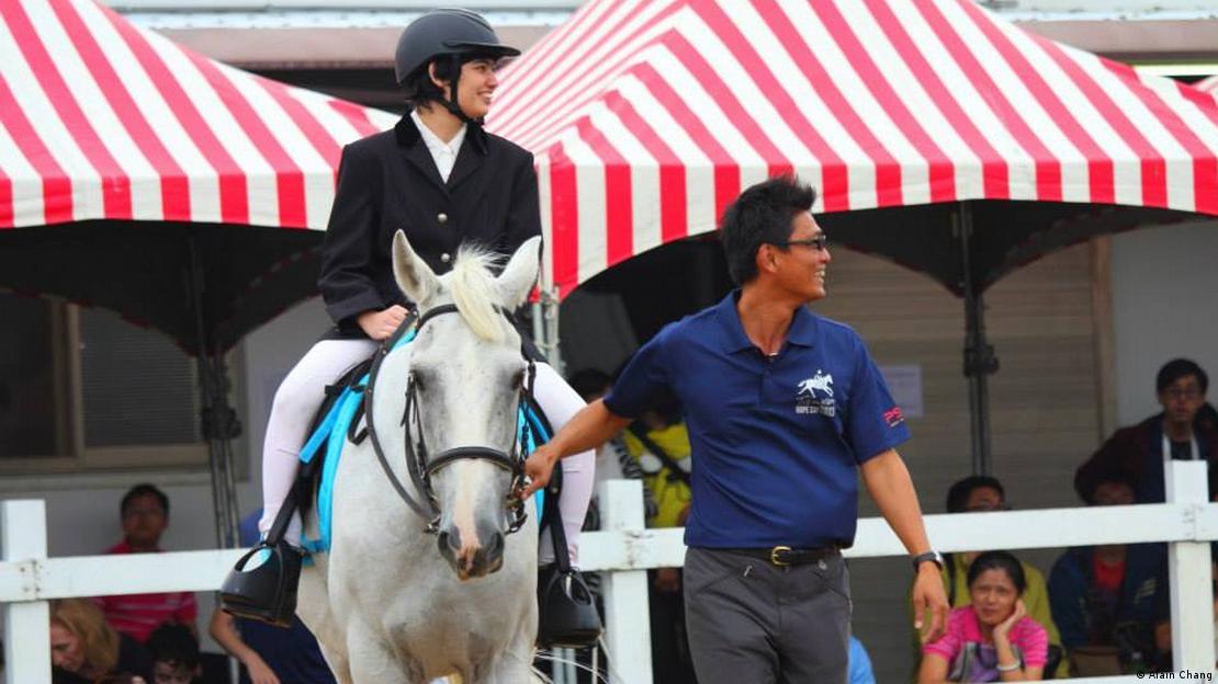 The picture shows An'an riding a horse.