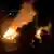 This frame grab taken from a handout video released by the Ministry of Security of the Province of Buenos Aires shows a fire after an explosion in an industrial area of Ezeiza