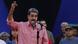 Nicolás Maduro levanta el brazo derecho mientras arenga a la gente en un acto público. Nicolás Maduro levanta el brazo derecho mientras arenga a la gente en un acto público.