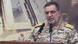 IRGC spokesperson Ali Mohammed Naini speaking into two microphones while wearing military uniform IRGC spokesperson Ali Mohammed Naini speaking into two microphones while wearing military uniform