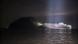 Side view of South Korean passenger ferry stranded at night after having hit small island Side view of South Korean passenger ferry stranded at night after having hit small island