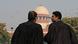 Two male lawyers, dressed in robes, talk to each other with the dome of the Supreme Court in New Delhi in the background Two male lawyers, dressed in robes, talk to each other with the dome of the Supreme Court in New Delhi in the background