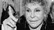 Ornella Vanoni (in black and white) raises a finger in a tight photo to her face Ornella Vanoni (in black and white) raises a finger in a tight photo to her face