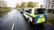 Police vans line a street in Hannover Police vans line a street in Hannover