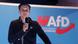Jean-Pascal Hohm podczas przemówienia. Za nim napis "AfD. Oddział Brandenburgia" Jean-Pascal Hohm podczas przemówienia. Za nim napis "AfD. Oddział Brandenburgia"