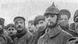 Historical black-and-white photo shows English and German soldiers standing side by side during the Christmas Truce of World War I. Historical black-and-white photo shows English and German soldiers standing side by side during the Christmas Truce of World War I.