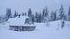 A snow-covered wooden cabin with triangular window amid a snowy pine forest under crescent moon, a heat pump is visible alongside the facade A snow-covered wooden cabin with triangular window amid a snowy pine forest under crescent moon, a heat pump is visible alongside the facade