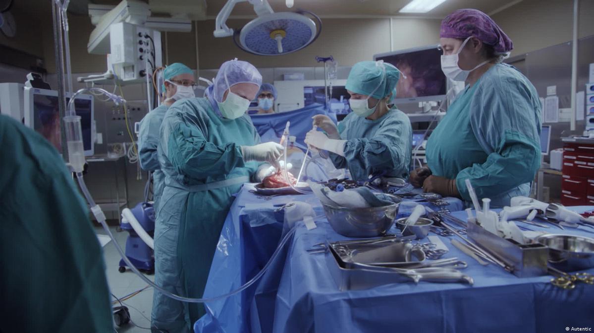 Doctors and nurses in an operation theater working on a heart transplant
