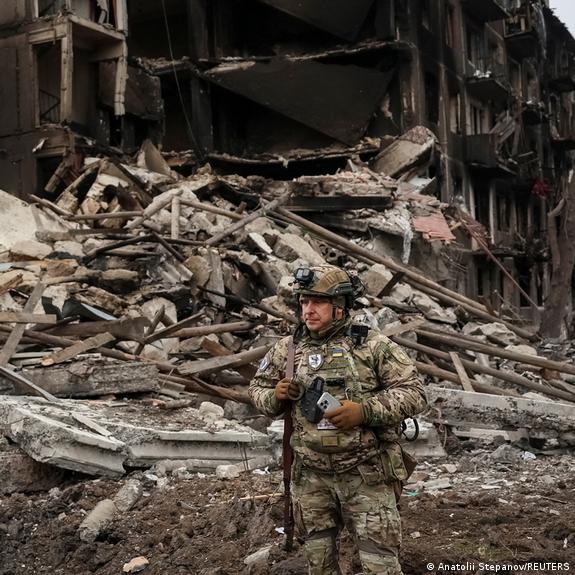 A Ukrainian police officer checks an area for residents amid the wreckage of the frontline town of Dobropillia A Ukrainian police officer checks an area for residents amid the wreckage of the frontline town of Dobropillia