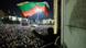 A student waves the Bulgarian flag, standing in a window above a huge crowd of people in central Sofia at night A student waves the Bulgarian flag, standing in a window above a huge crowd of people in central Sofia at night