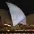 The Sydney Opera House illuminated with a Jewish menorah December 15, 2025.