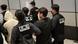 A man being arrested in South Korea A man being arrested in South Korea