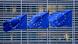 European Union flags flutter outside the EU Commission headquarters in Brussels