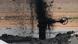 Oil spraying from a well at Tuba oil field, west of Basra, Iraq, on February 19, 2015 Oil spraying from a well at Tuba oil field, west of Basra, Iraq, on February 19, 2015