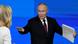 Rusya lideri Vladimir Putin ellerini iki yana açmış, sol elinde bir dosya tutuyor Rusya lideri Vladimir Putin ellerini iki yana açmış, sol elinde bir dosya tutuyor