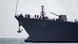 US Navy battleship USS Thomas Hudner with crew visible on deck US Navy battleship USS Thomas Hudner with crew visible on deck