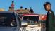 A soldier stands as vehicles leave a border town after fresh clashes between Thailand and Cambodia, in Poipot, Cambodia, on December 22, 2025 A soldier stands as vehicles leave a border town after fresh clashes between Thailand and Cambodia, in Poipot, Cambodia, on December 22, 2025