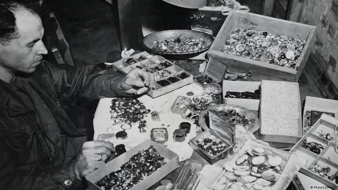 Looted valuables, including thousands of weddings rings, gold teeth fillings, discovered in a cave at Buchenwald concentration camp in April 1945.