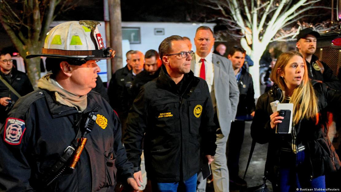 Pennsylvania Governor Josh Shapiro walks next to a firefighter at Bristol, Pennsylvania, December 23, 2025