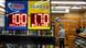 A convenience store employee prays while Jackpot payouts for Powerball and Mega Millions are displayed outside the store, Tuesday, Dec. 23, 2025, in New York, US A convenience store employee prays while Jackpot payouts for Powerball and Mega Millions are displayed outside the store, Tuesday, Dec. 23, 2025, in New York, US