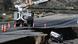 A car flipped upside down on a damaged road, Phelan, California, US A car flipped upside down on a damaged road, Phelan, California, US