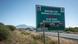 A road sign warns of possible wildlife crossings along the road from Arusha to the Ngorongoro Conservation Area, northern Tanzania.