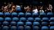 Spectators use handheld fans to cool themselves down from the heat as empty seats are seen at Australian Open Spectators use handheld fans to cool themselves down from the heat as empty seats are seen at Australian Open
