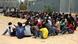 African migrants sitting on the ground in a Libyan detention center in June 2015 African migrants sitting on the ground in a Libyan detention center in June 2015