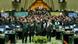Iranian lawmakers wearing green Islamic Revolutionary Guard Corps uniforms chant with raised fists in parliament Iranian lawmakers wearing green Islamic Revolutionary Guard Corps uniforms chant with raised fists in parliament