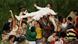 Bad Bunny surfs on a crowd of people during his superbowl performance Bad Bunny surfs on a crowd of people during his superbowl performance