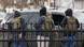 Federal agents stand outside while staging in a parking lot in Minneapolis, Minnesota, on February 10, 2026 Federal agents stand outside while staging in a parking lot in Minneapolis, Minnesota, on February 10, 2026