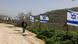 A Palestinian man from the village of Burqa, walks past a fence decorated with Israeli flags installed by Jewish settlers after they announced their control over the historical Al-Masoudiya Ottoman era train station, which operated between the Palestinian cities of Nablus and Tulkarm in the 1920s, just north of the city of Nablus, in the northern Israeli-occupied West Bank on February 15, 2026 A Palestinian man from the village of Burqa, walks past a fence decorated with Israeli flags installed by Jewish settlers after they announced their control over the historical Al-Masoudiya Ottoman era train station, which operated between the Palestinian cities of Nablus and Tulkarm in the 1920s, just north of the city of Nablus, in the northern Israeli-occupied West Bank on February 15, 2026