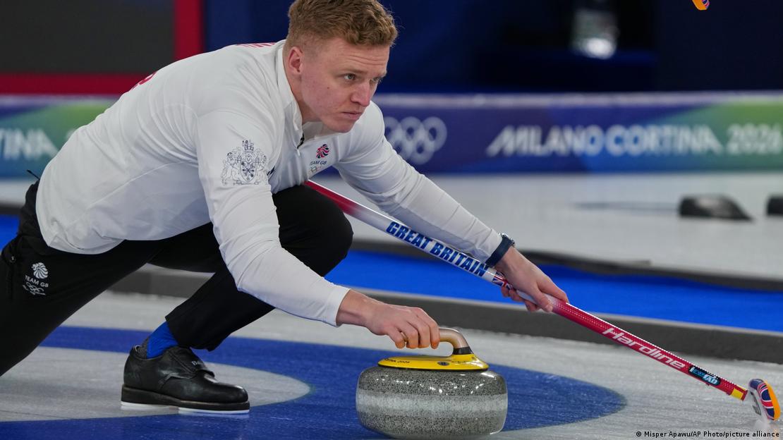 Britain's Bobby Lammie launching a stone against Germany