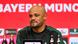 Bayern Munich coach Vincent Kompany sits behind a desk at a press conference Bayern Munich coach Vincent Kompany sits behind a desk at a press conference